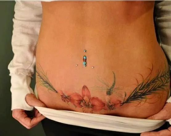 Lilly and peacock feather tattoo on pelvis | Tats | Pinterest ...