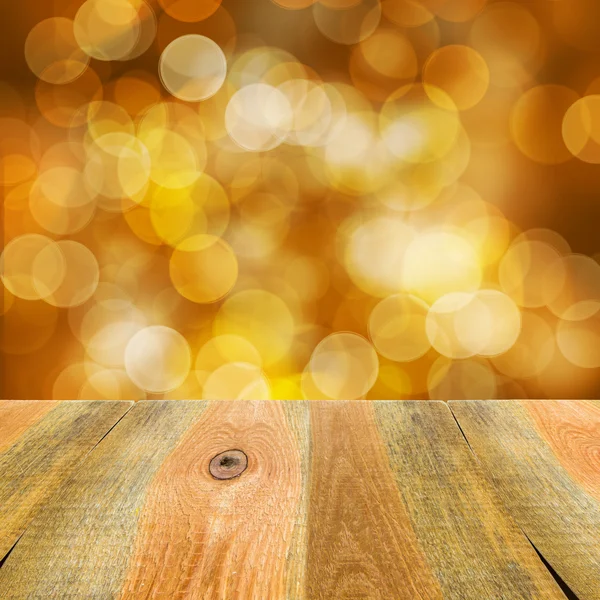 Mesa de madera de fondo naranja amarillo bokeh — Foto stock ...