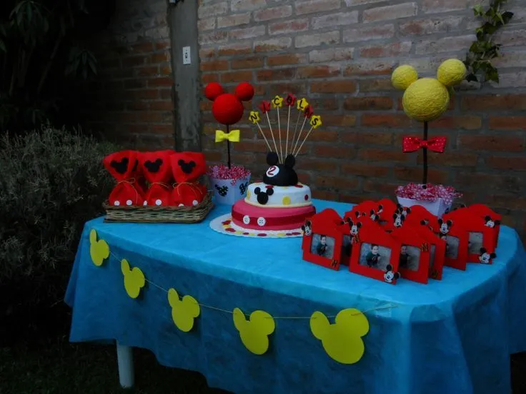 Mickey Mouse birthday table set up, goodie bags, cake and ...