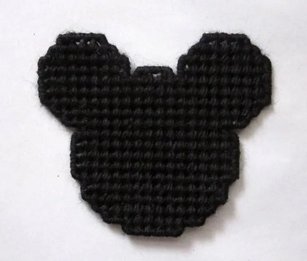 Mickey Mouse silhouette magnet in plastic canvas by AuntCC