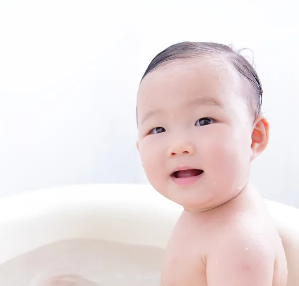niña sonríe tomando un baño — Foto stock © ryanking999 #16980373