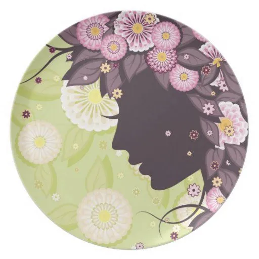 Placa con la silueta y las flores de la cara de la platos de ... Placa con la silueta y las flores de la cara de la platos de ...