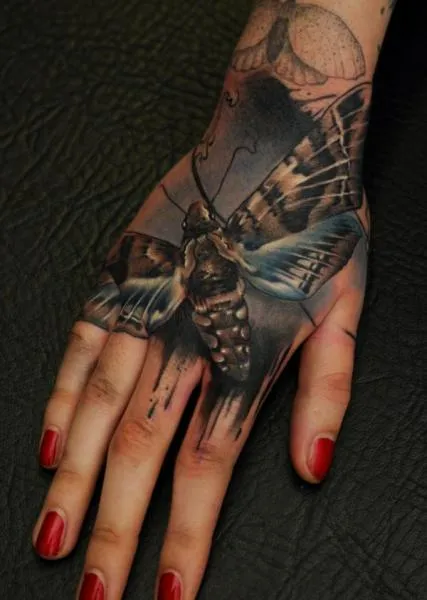 tattoo-realistic-hand-moth.jpg