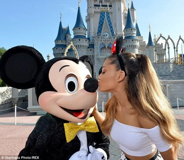 Ariana Grande kisses Mickey Mouse as she celebrates turning 21 at ... Ariana Grande kisses Mickey Mouse as she celebrates turning 21 at ...