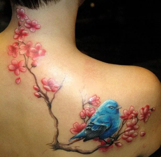 Ave Azul sobre Flores de Cerezo - Tatuajes para Mujeres