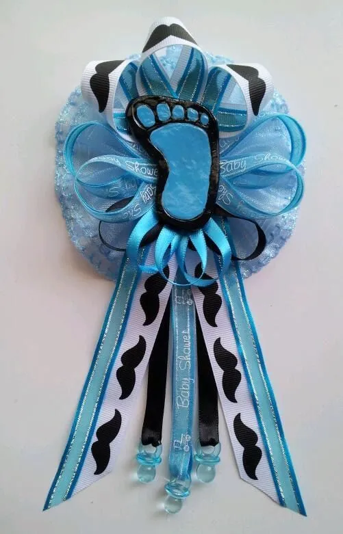 Mustache theme Mommy Baby Shower corsage with baby footprint centerpi…
