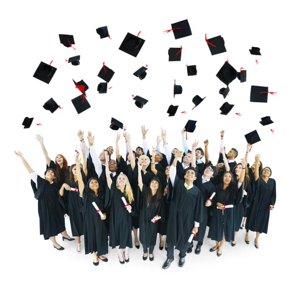 Birretes de graduación lanzados en el aire — Foto stock © Rawpixel ... Birretes de graduación lanzados en el aire — Foto stock © Rawpixel ...