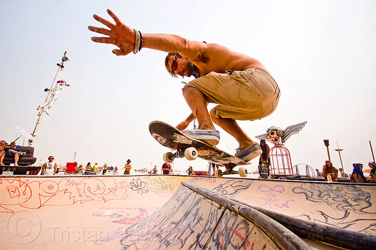 burning man 2013, skateboarder jumping at skate park burning man 2013, skateboarder jumping at skate park