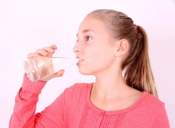 chica rubia bebe agua de un vaso — Foto stock © diamant24 #16250871