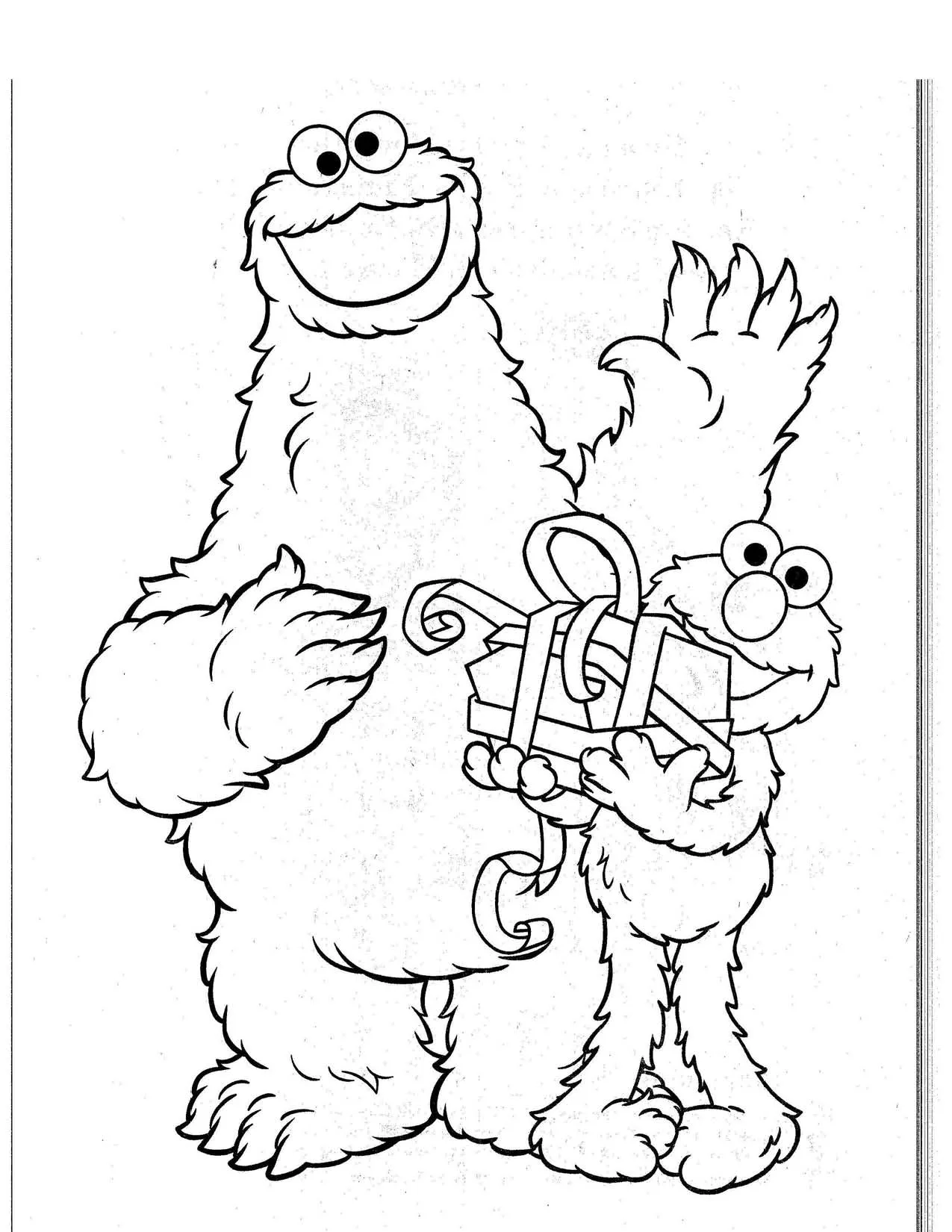 Elmo haciendo un regalo de navidad al monstruo de las galletas Elmo haciendo un regalo de navidad al monstruo de las galletas