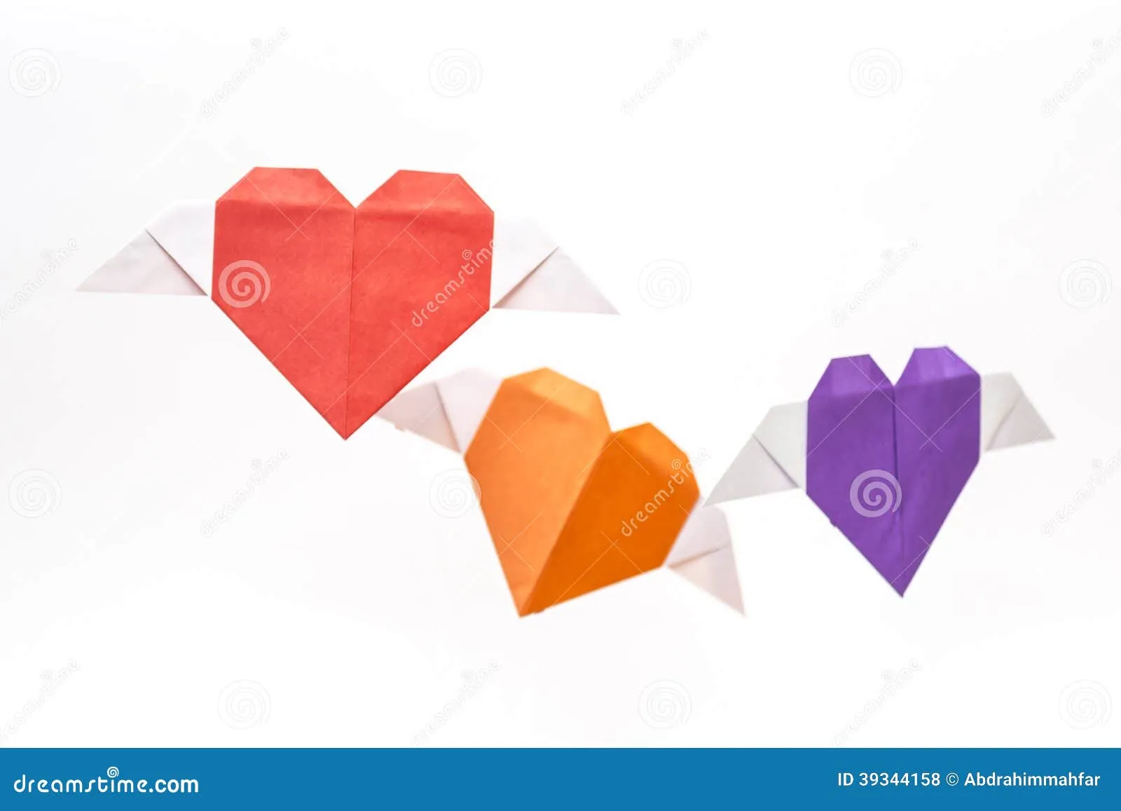 Forma Del Corazón De La Papiroflexia Con Las Alas Foto de archivo ... Forma Del Corazón De La Papiroflexia Con Las Alas Foto de archivo ...