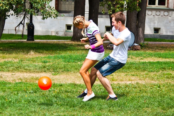 Hombre y mujer jugando al fútbol — Foto stock © korvin79 #18002129 Hombre y mujer jugando al fútbol — Foto stock © korvin79 #18002129
