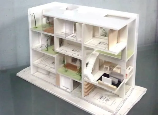 House K: edificio para 2 viviendas, con patios ajardinados