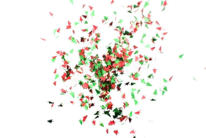... image composed of flying christmas tree shaped confetti pieces ... image composed of flying christmas tree shaped confetti pieces