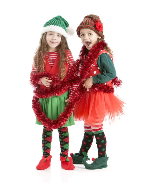 jóvenes elfos de Navidad enredan en garland — Imagen de stock #21427425 jóvenes elfos de Navidad enredan en garland — Imagen de stock #21427425
