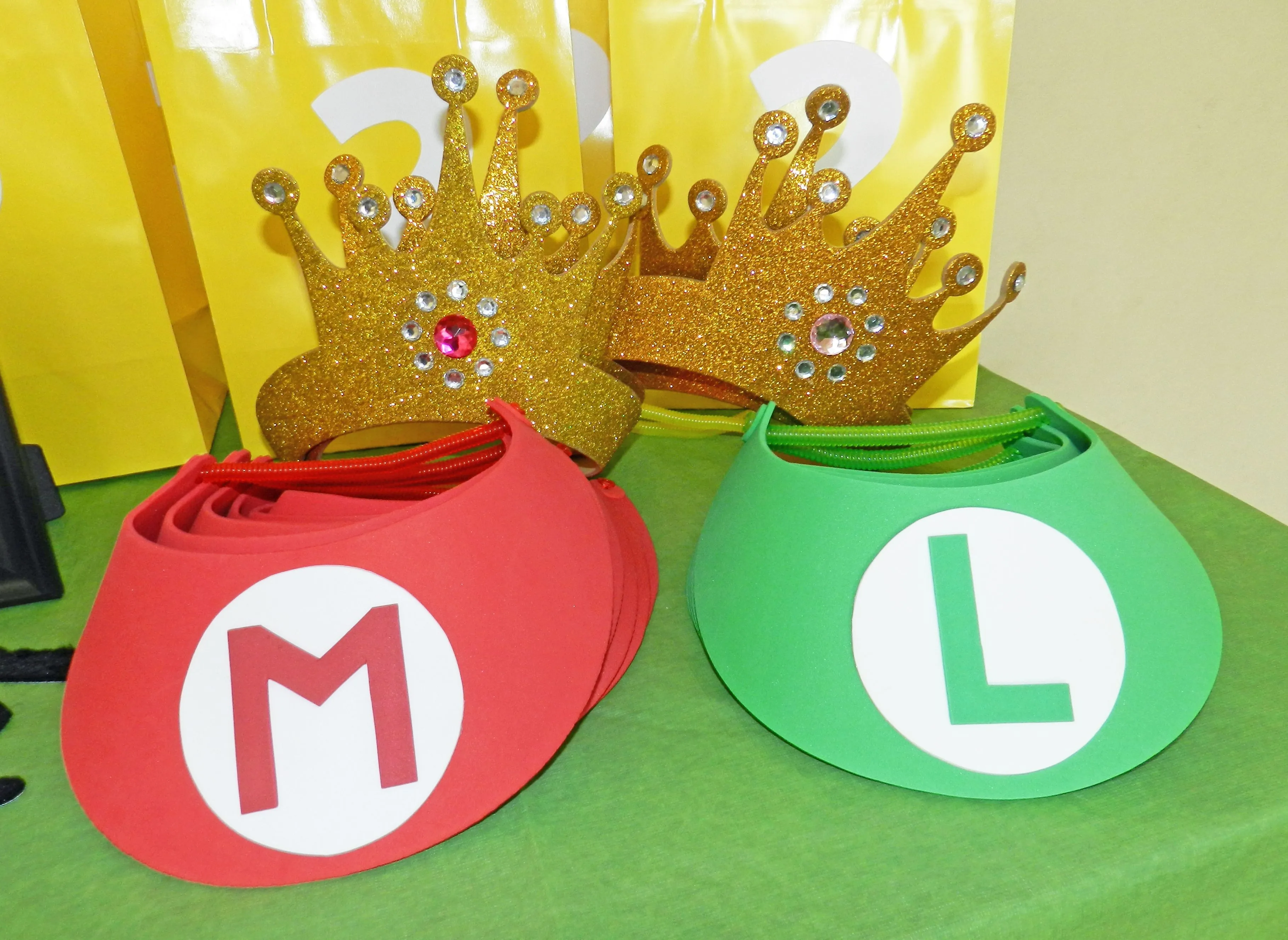 Mario & Luigi hats, Princess Peach crowns all made out of foamy hats. | Decoracion de mario bros, Cumple de mario bros, Fiesta de mario bros Mario & Luigi hats, Princess Peach crowns all made out of foamy hats. | Decoracion de mario bros, Cumple de mario bros, Fiesta de mario bros