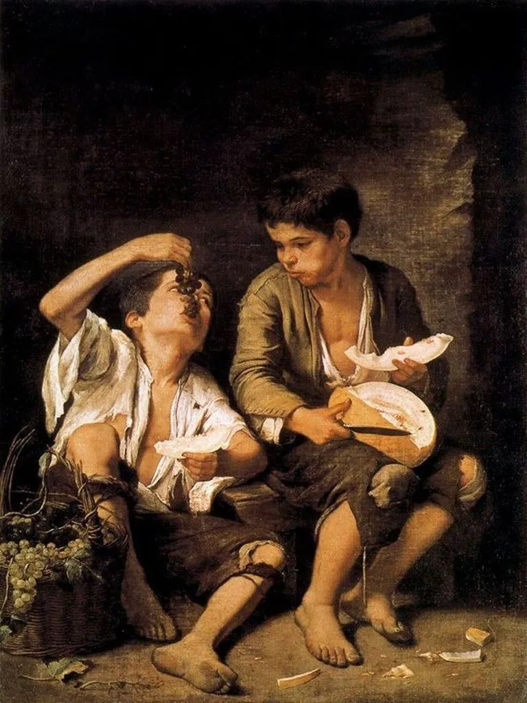 ñiños comiendo uva y melon: