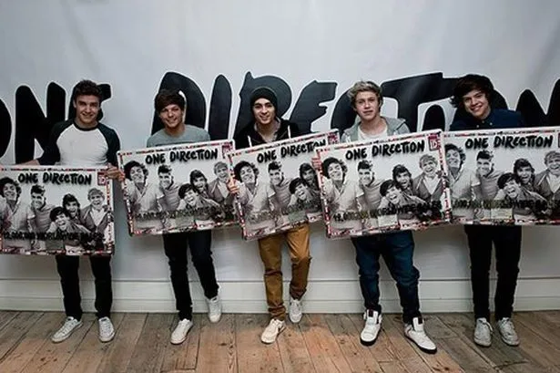 One Direction debut album Up All Night sells record breaking 12 ...