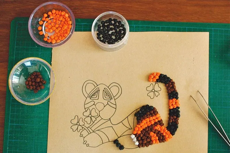 Realizar un pequeño tigre con bolas de papel de seda de colores | Canson® Realizar un pequeño tigre con bolas de papel de seda de colores | Canson®