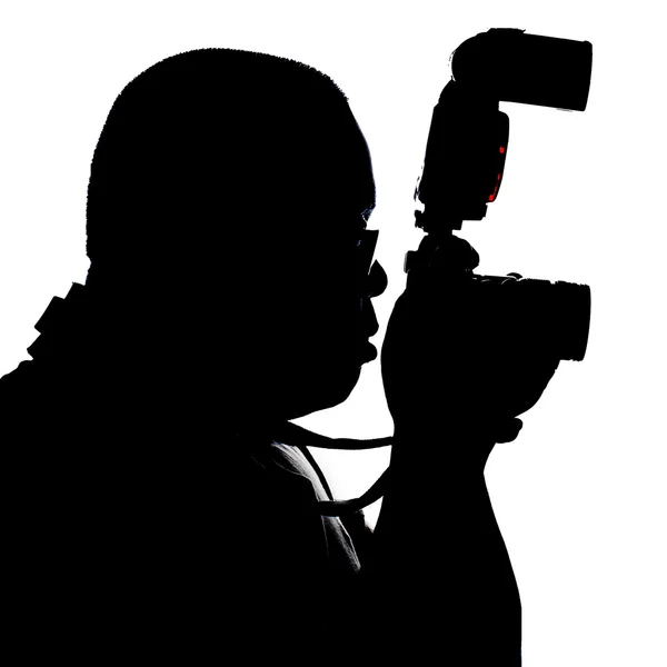 Silueta de un fotógrafo con su cámara y su flash gordo — Foto ...